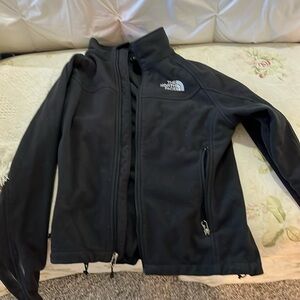 Women’s black North Face fleece jacket.